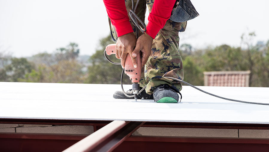 Man working on roof Metal cheese in site construction