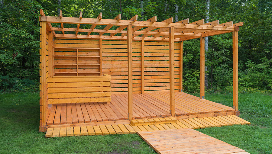 Skeleton wooden gazebo in the park